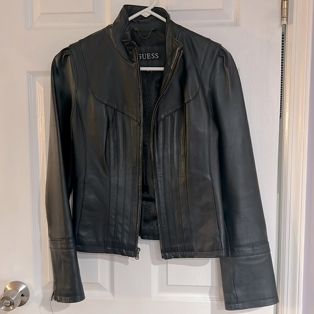 Gently used Guess black leather jacket. Size M zippered sleeves